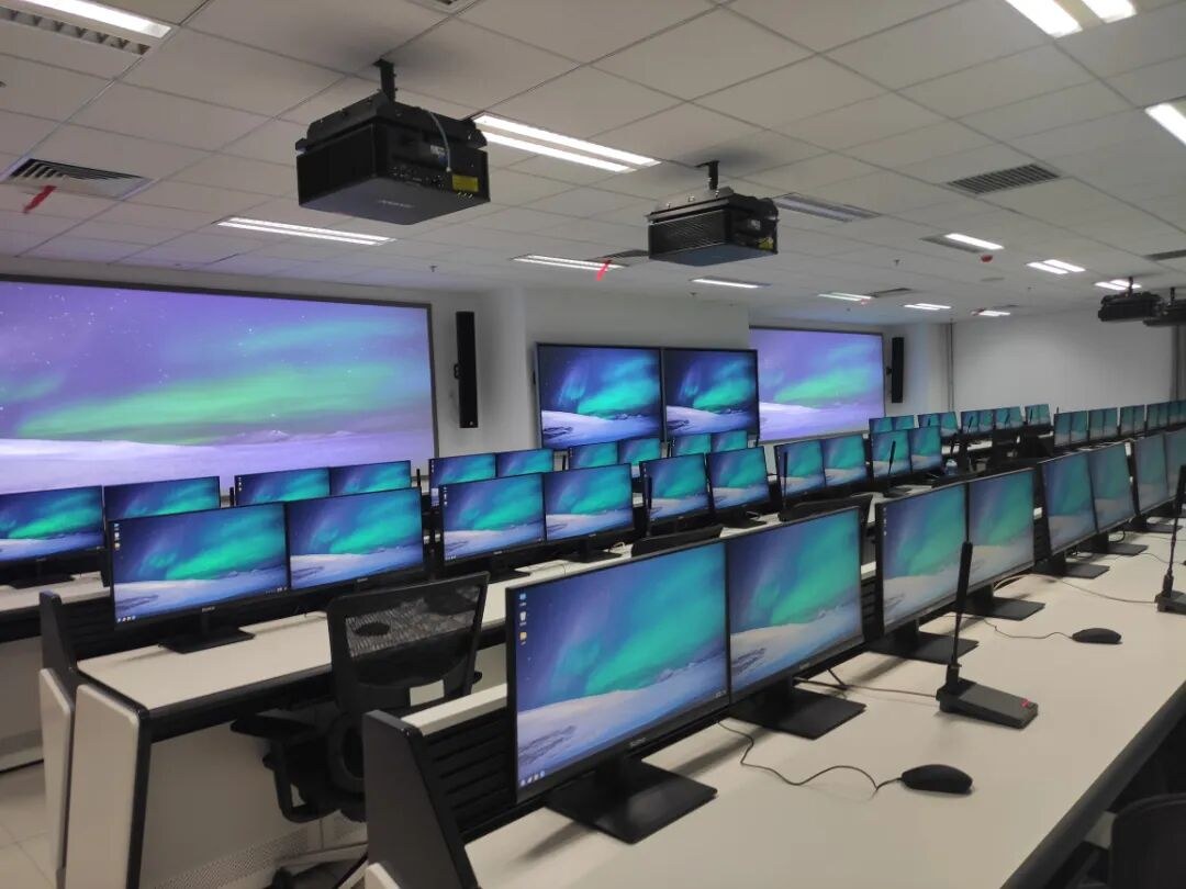 Rows of workstations in the new laboratory, each seat fitted with a TDN1 Dante digital microphone